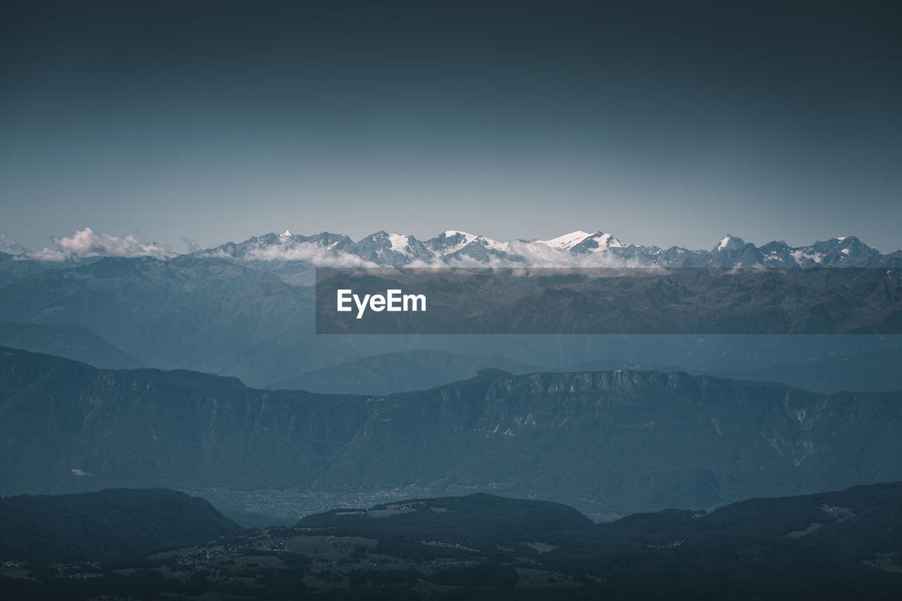 Scenic view of snowcapped mountains against sky