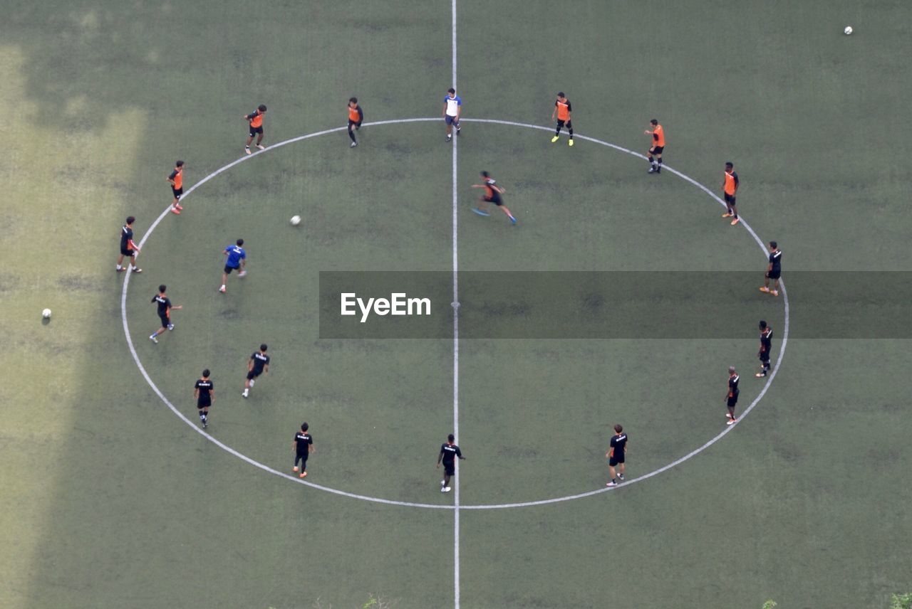 High angle view of people playing soccer on field