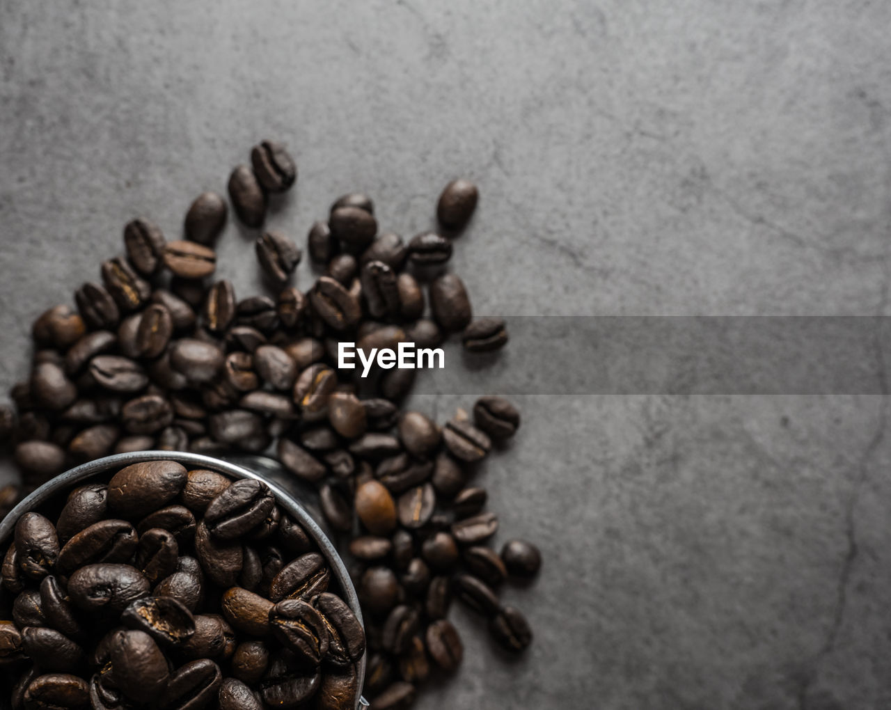 HIGH ANGLE VIEW OF COFFEE BEANS IN GLASS