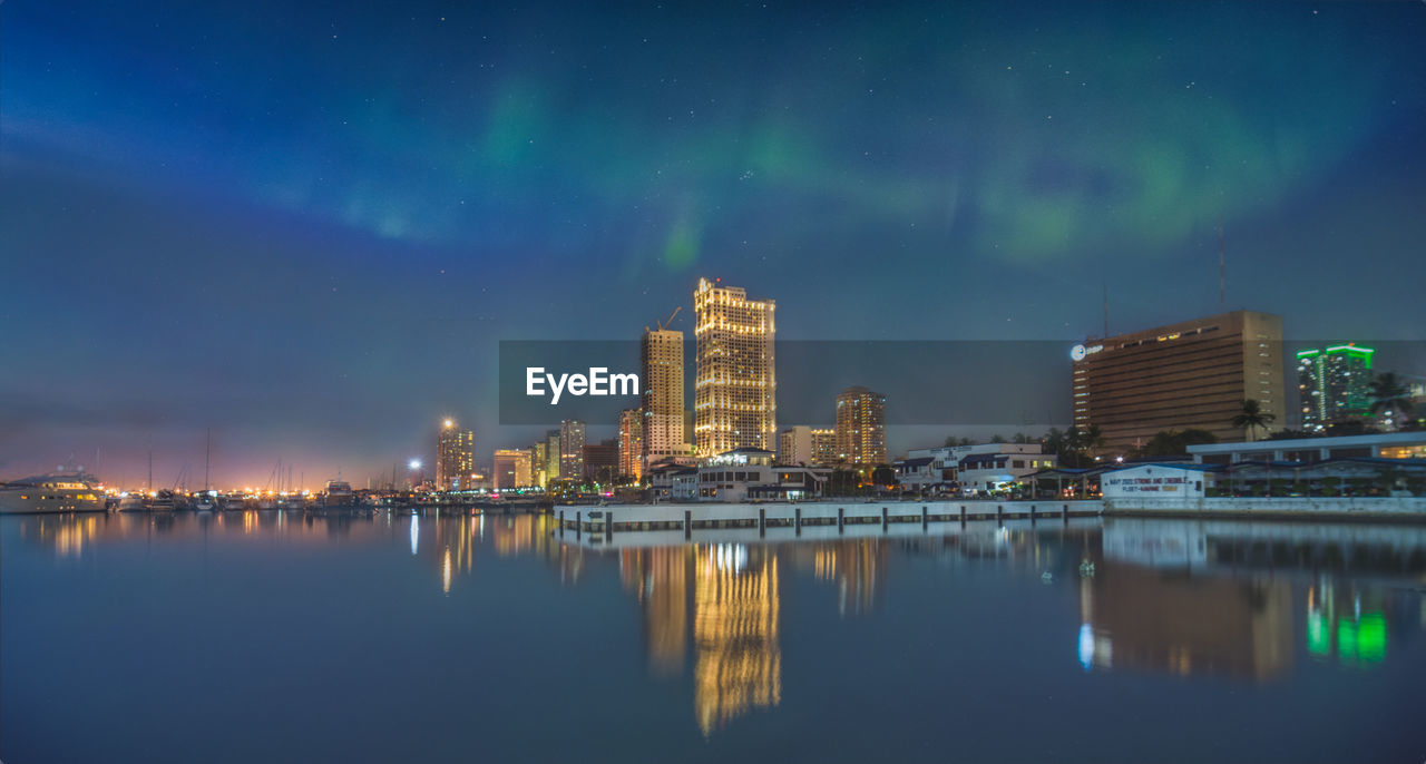 Composite photo of buildings in city at night