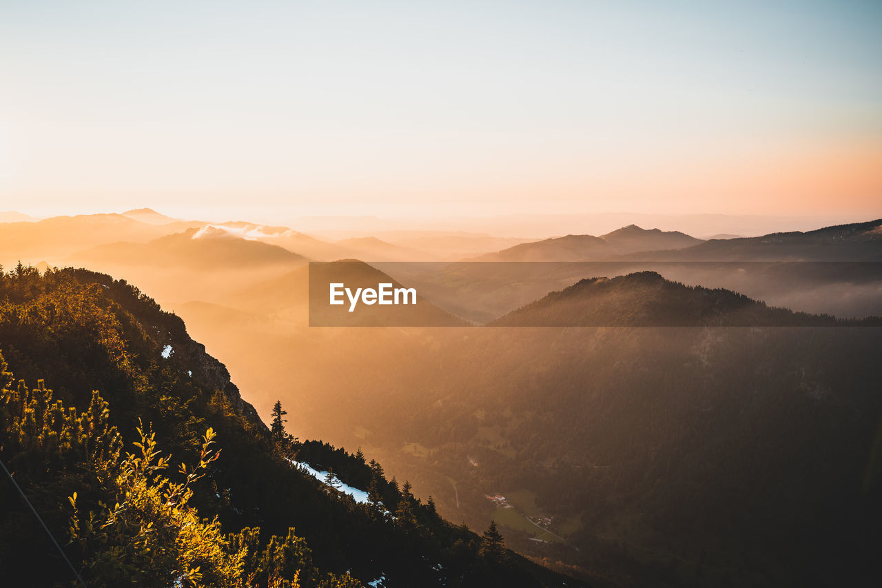 Scenic view of mountains against sky during sunset