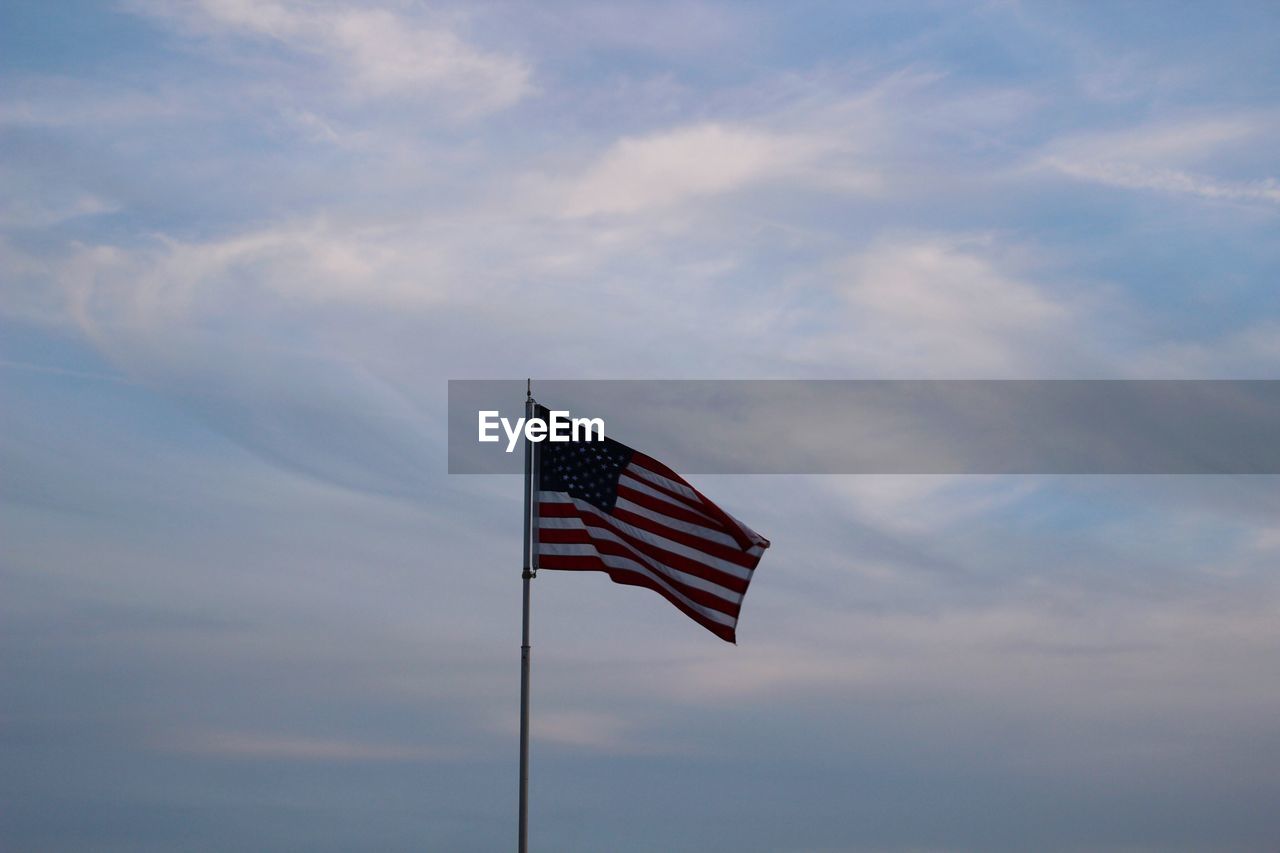 LOW ANGLE VIEW OF FLAG FLAGS AGAINST SKY