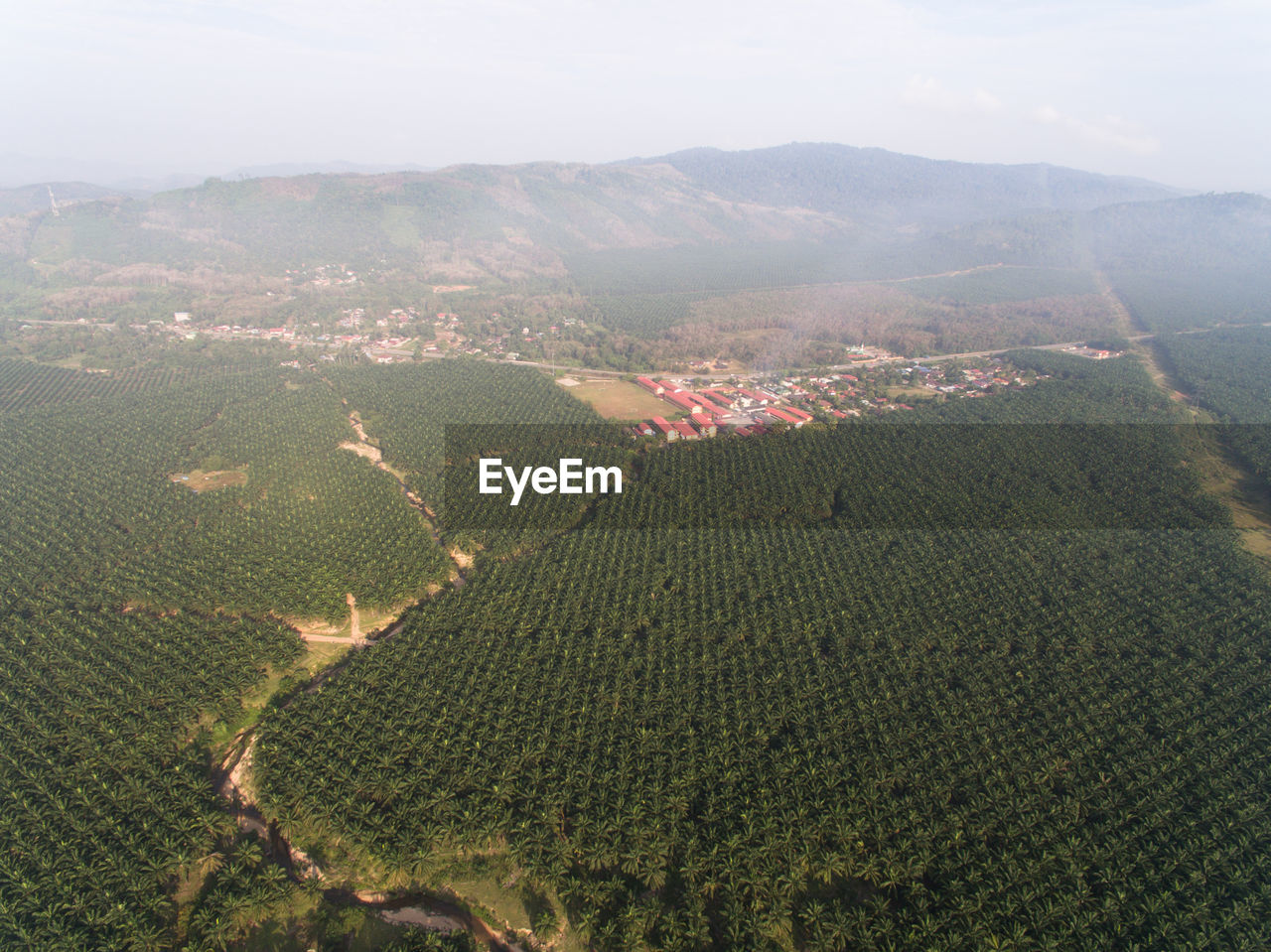 Aerial view hazy or misty morning view of a rural landscape countryside village