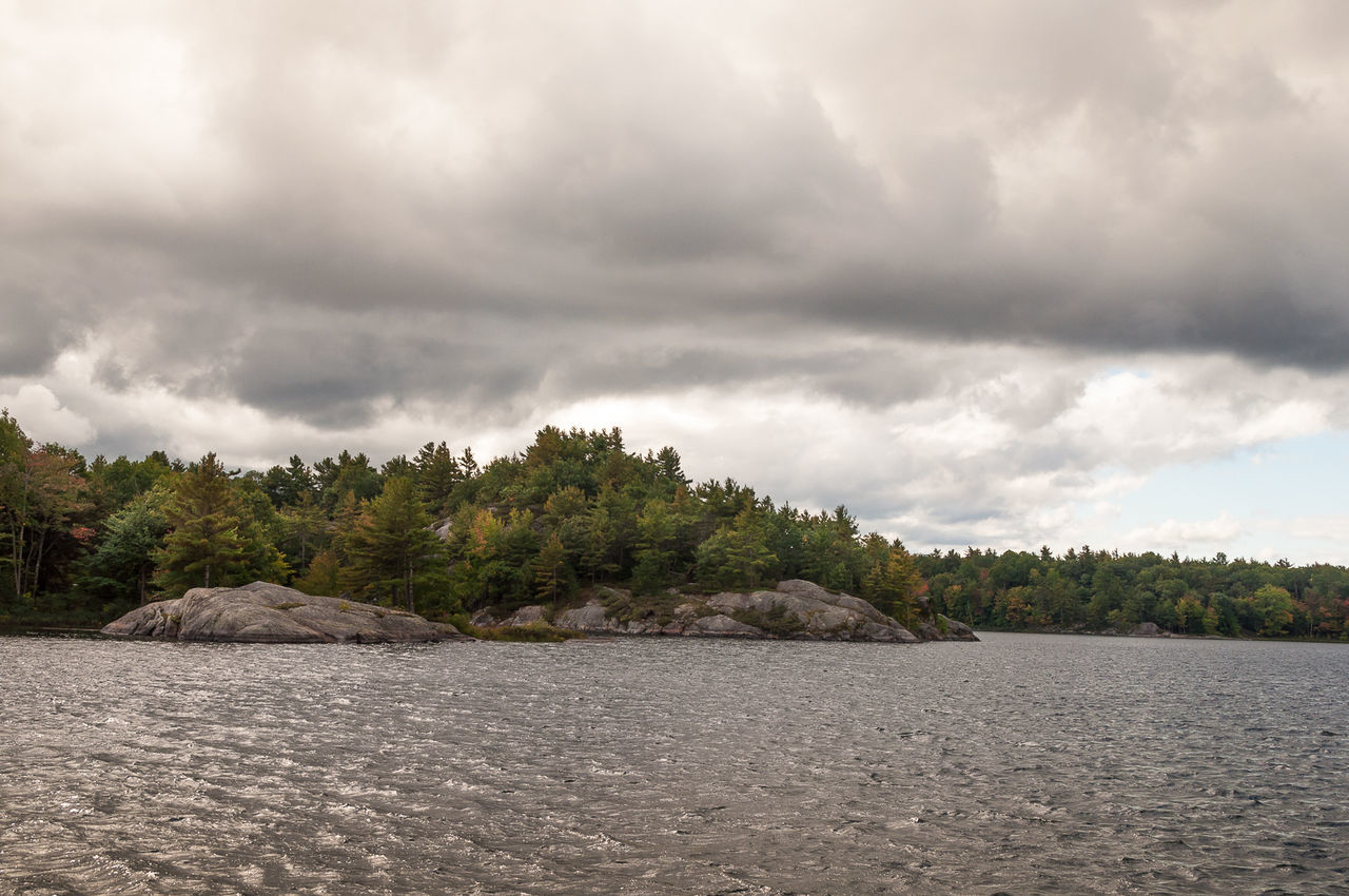 View of calm sea against cloudy sky