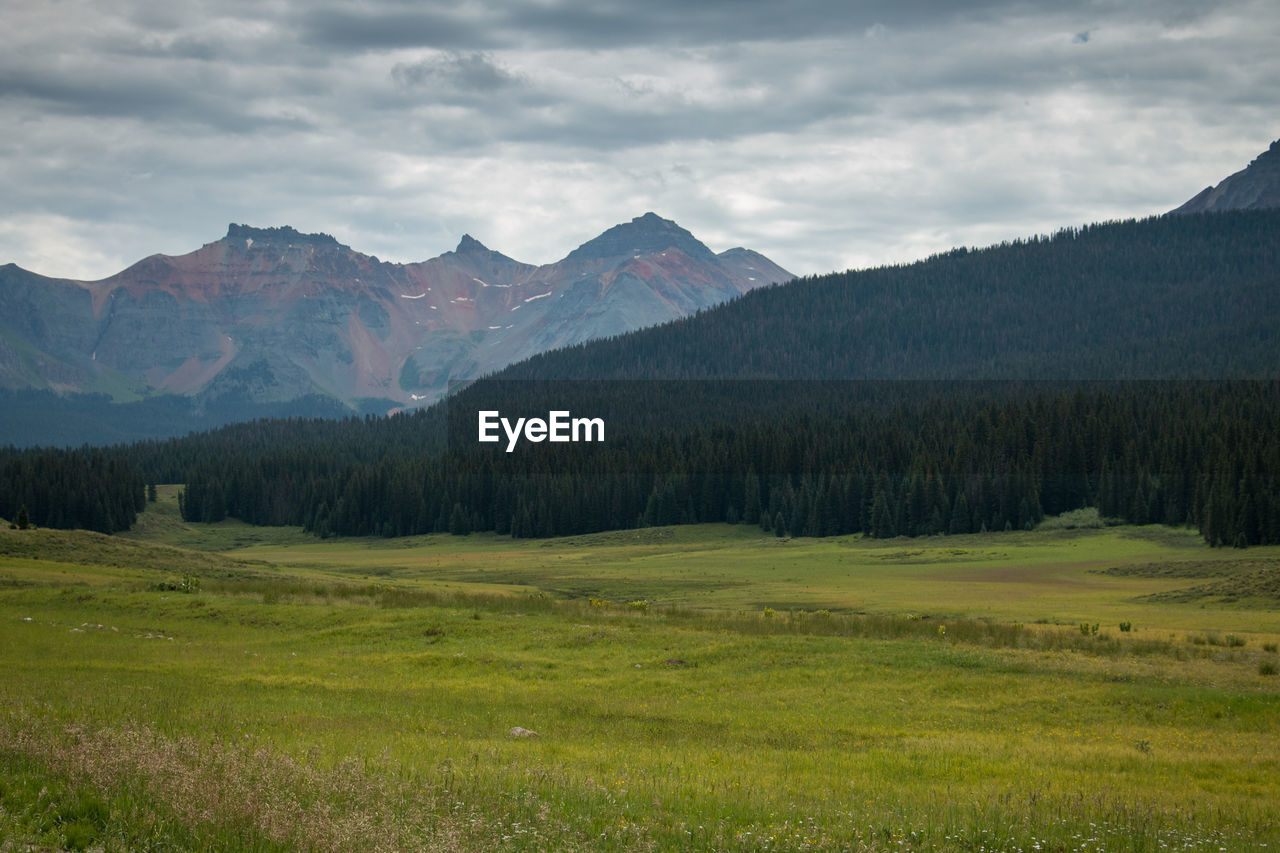 Scenic view of landscape and mountains against sky