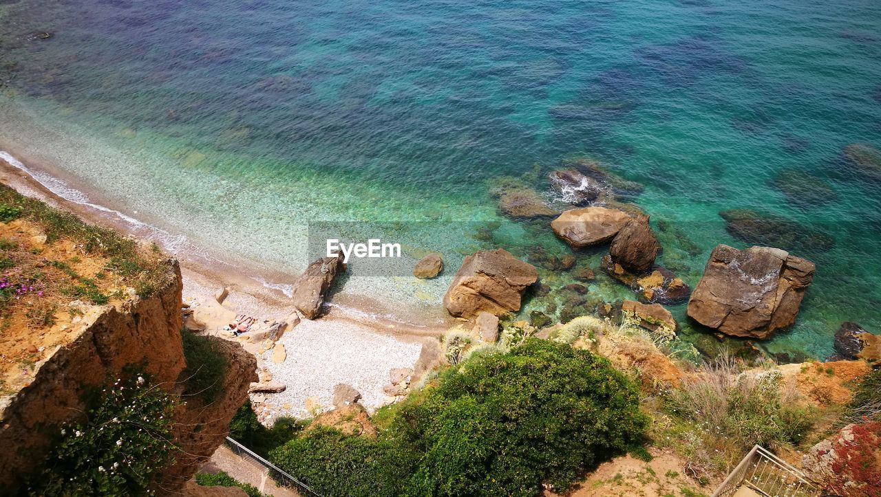 High angle view of rocks in sea