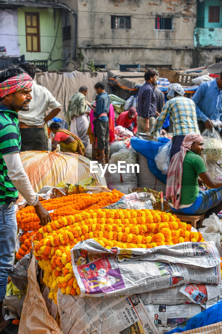 GROUP OF PEOPLE IN MARKET