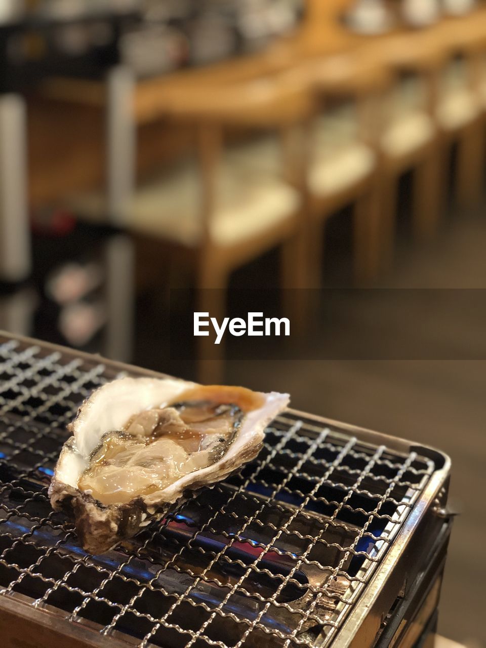 Close-up of oyster on japanese barbecue grill