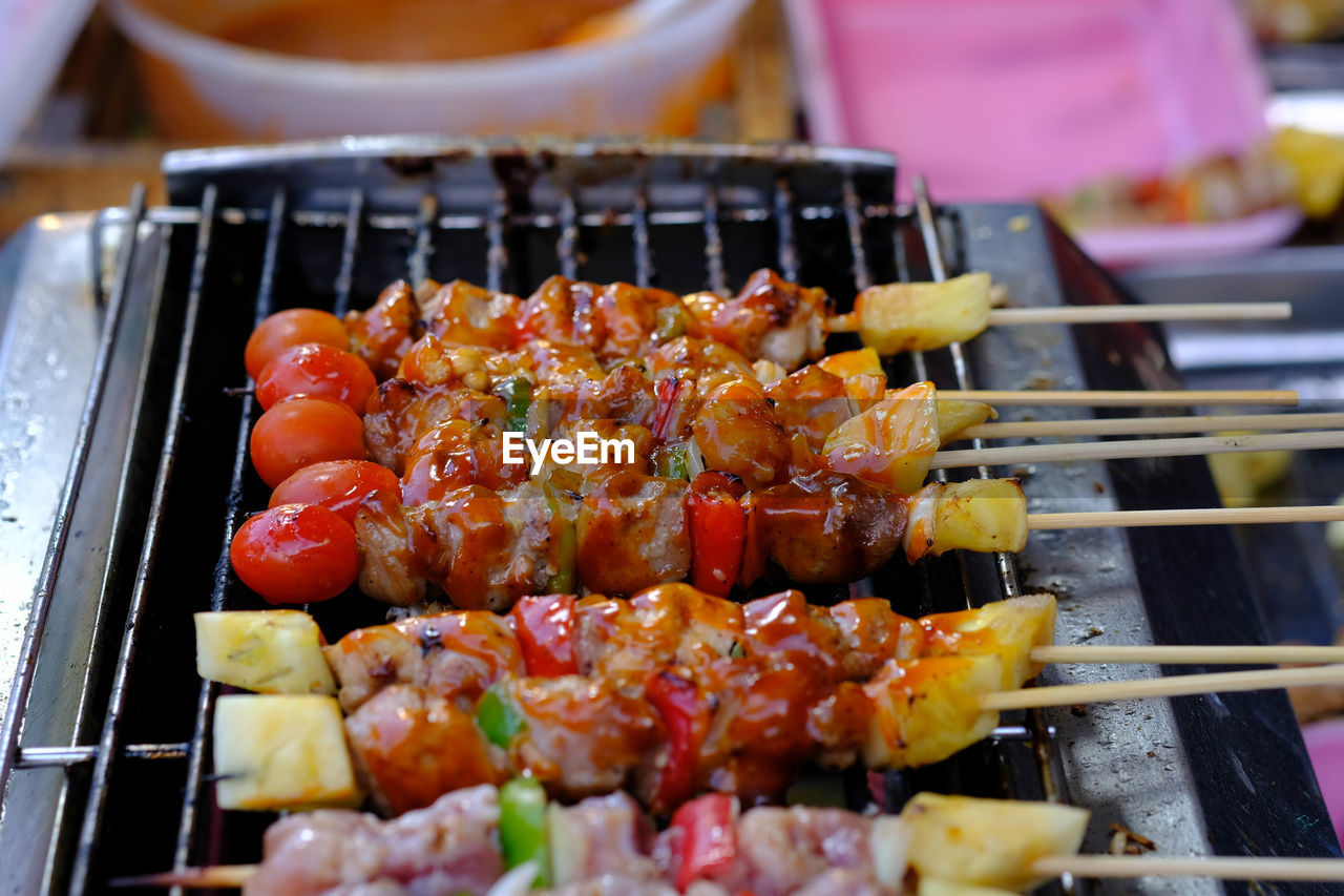 HIGH ANGLE VIEW OF VEGETABLES ON GRILL