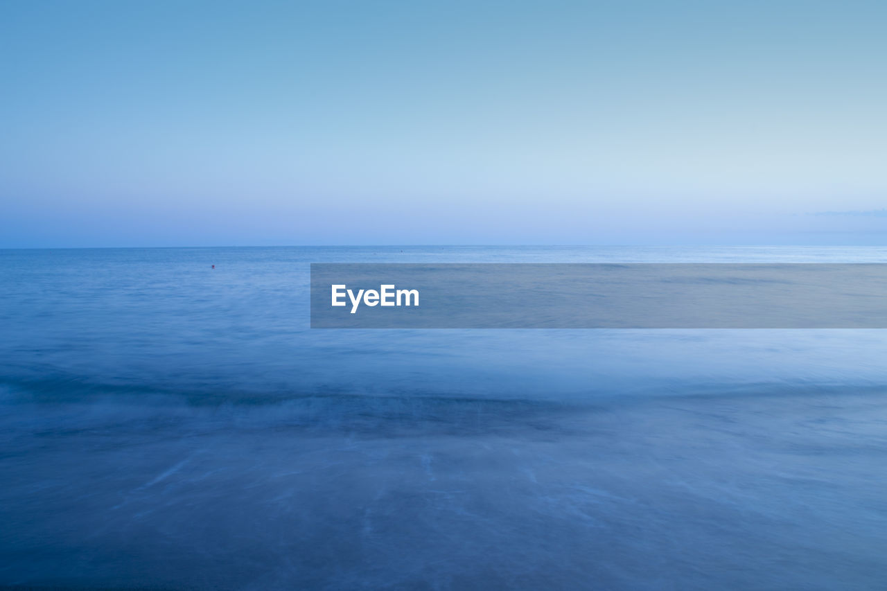 SCENIC VIEW OF SEA AGAINST BLUE SKY