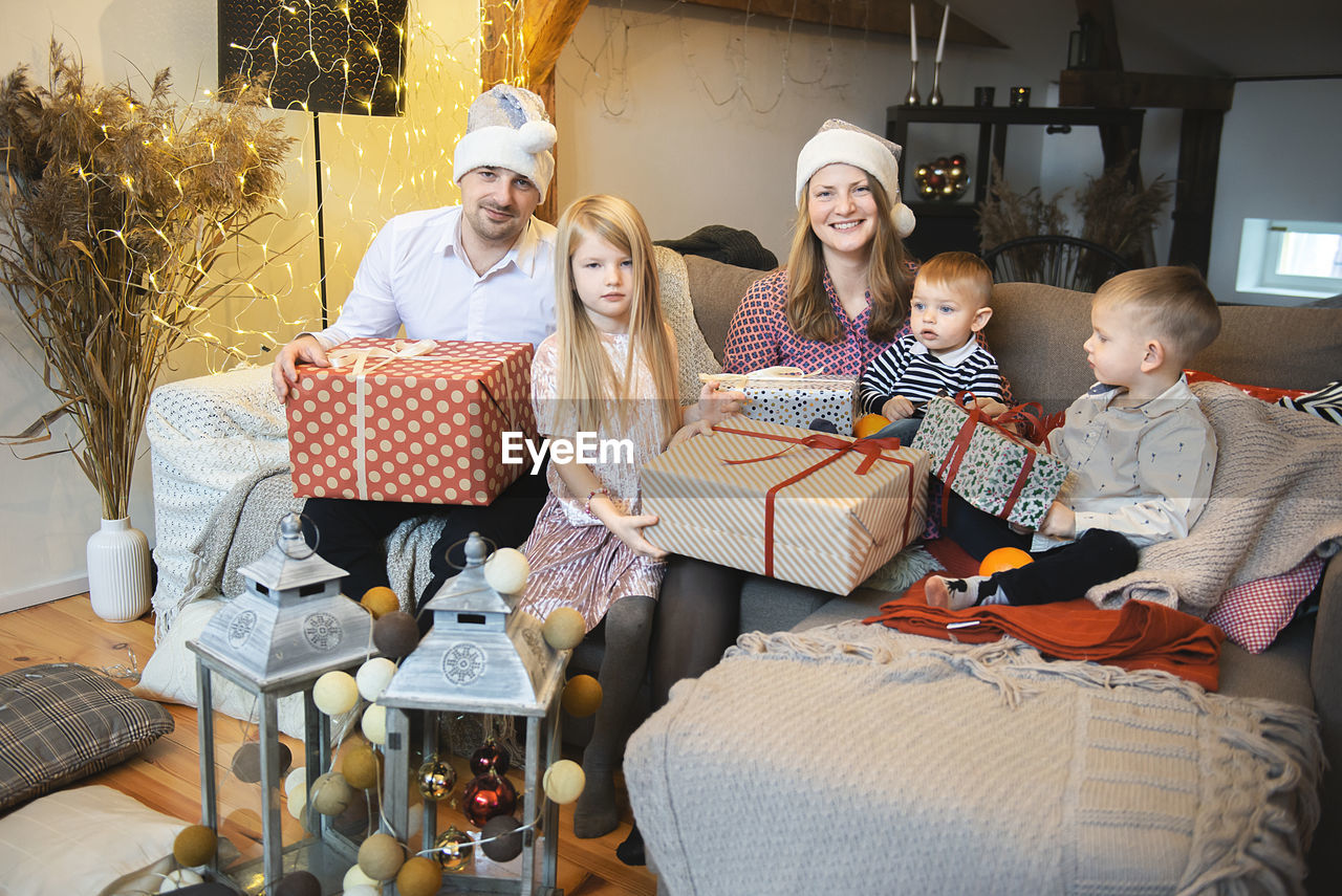 Happy family with three children celebration christmas at  home