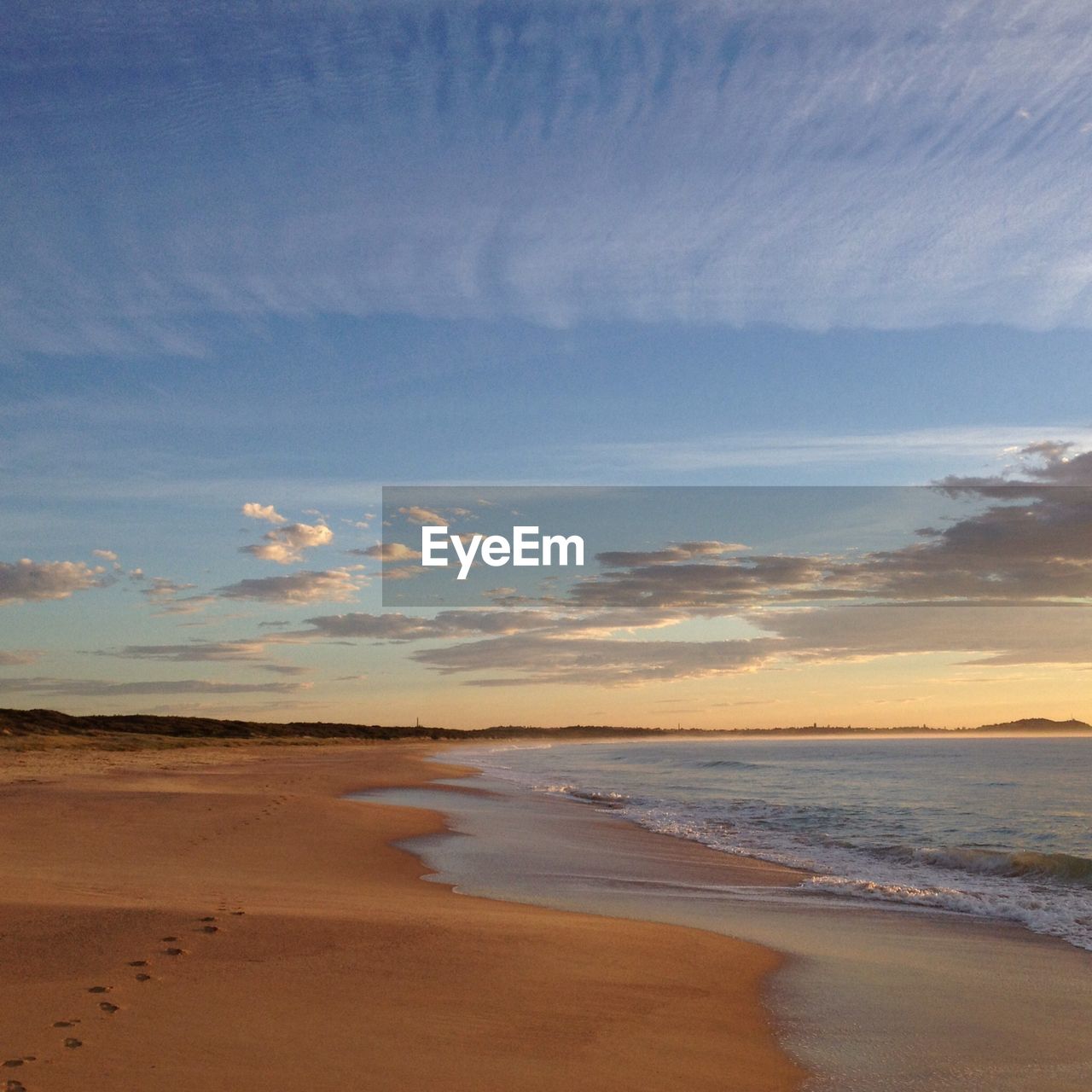 Beach during sunset against sky