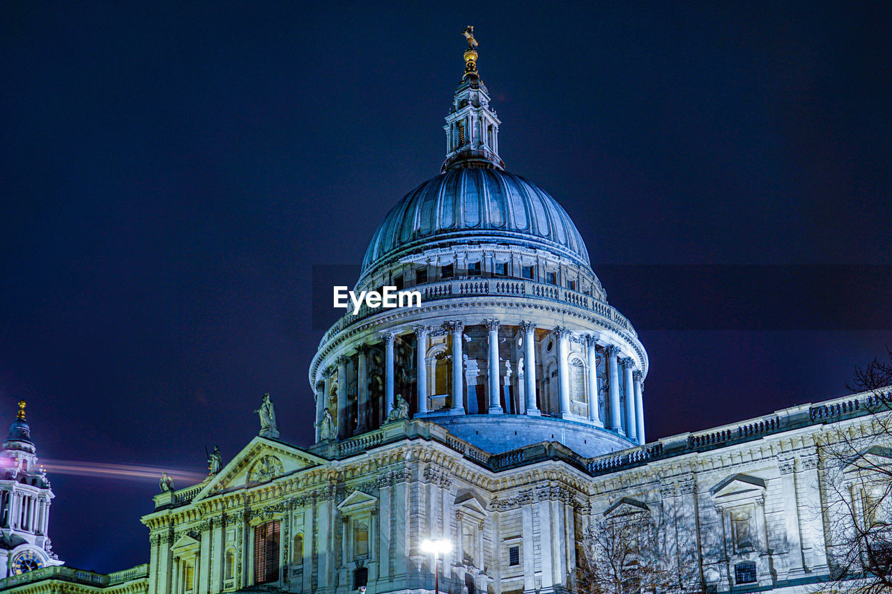 low angle view of cathedral against sky at night