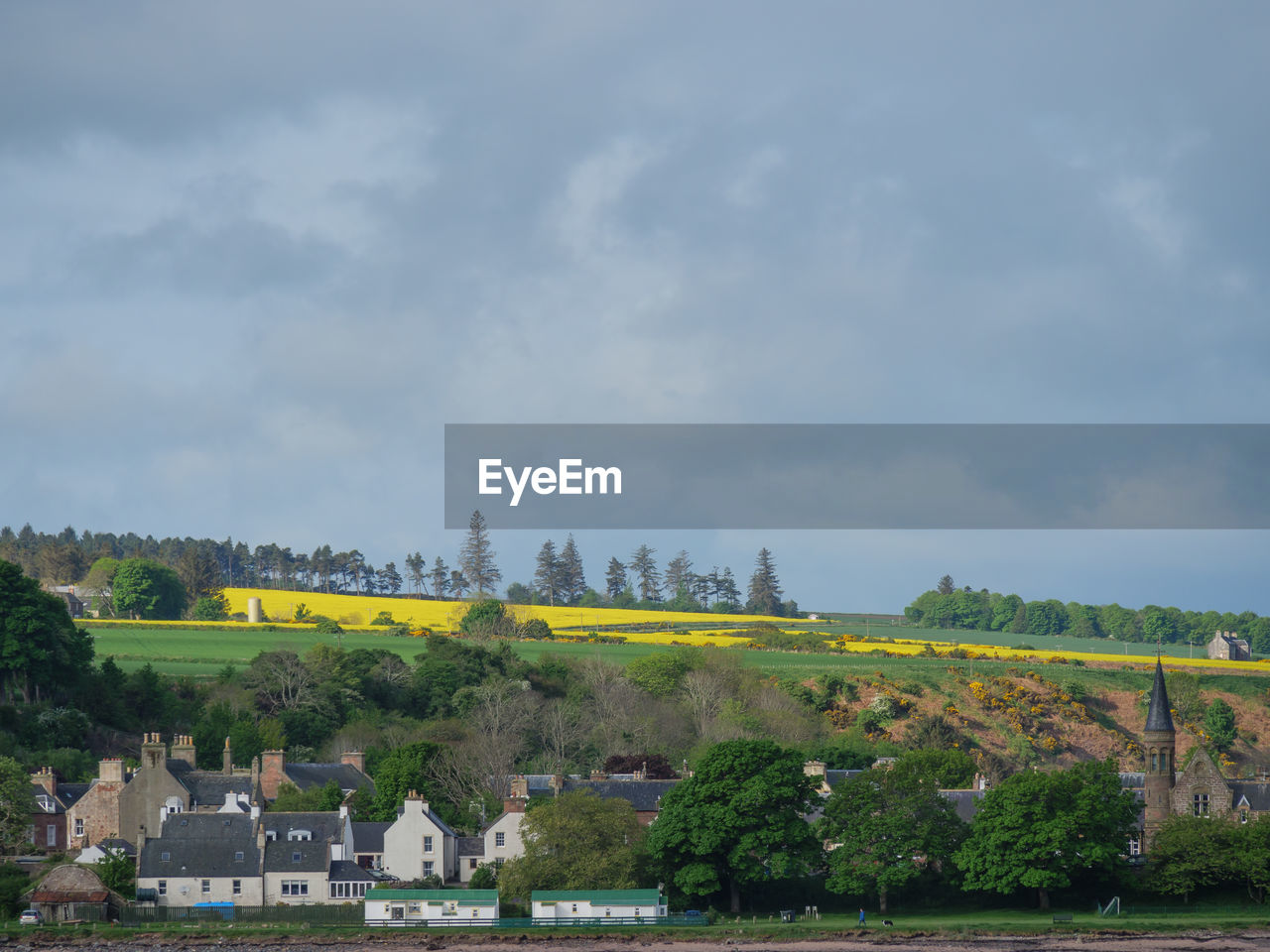 sky, architecture, plant, cloud, tree, nature, environment, rural area, built structure, hill, landscape, building exterior, building, land, river, water, no people, travel destinations, scenics - nature, travel, outdoors, city, day, beauty in nature, field, tourism, house, rural scene