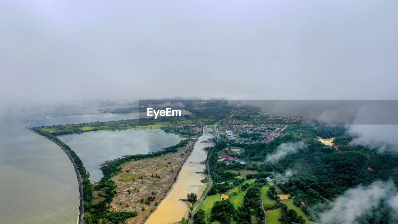 HIGH ANGLE VIEW OF BRIDGE AGAINST SKY DURING FOGGY WEATHER