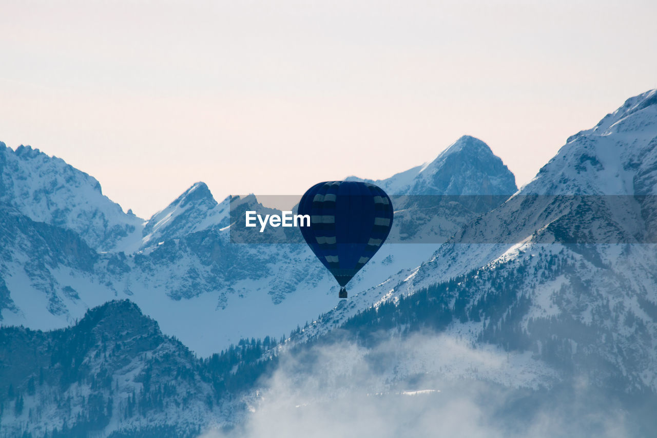 Snowcapped mountains against clear sky