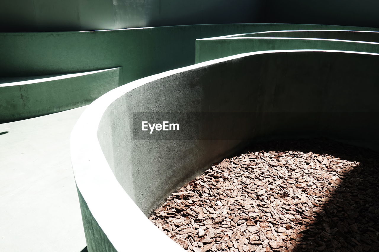 HIGH ANGLE VIEW OF COFFEE BEANS ON CONCRETE