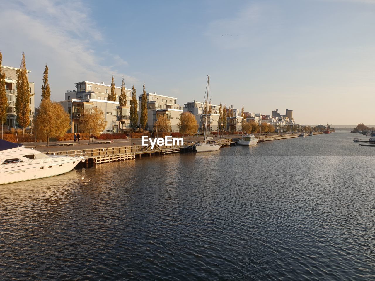 VIEW OF CITY BUILDINGS BY RIVER