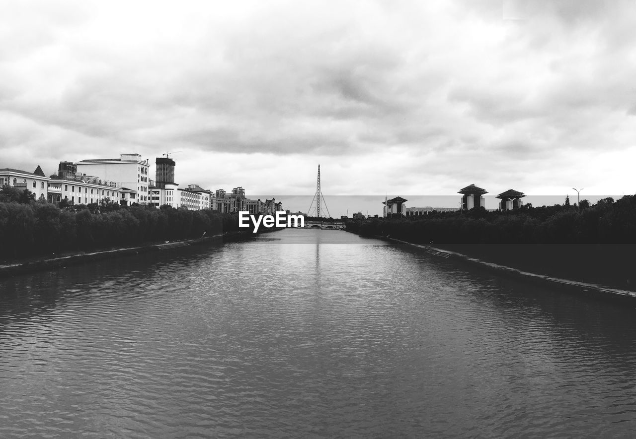 VIEW OF RIVER WITH BUILDINGS IN BACKGROUND