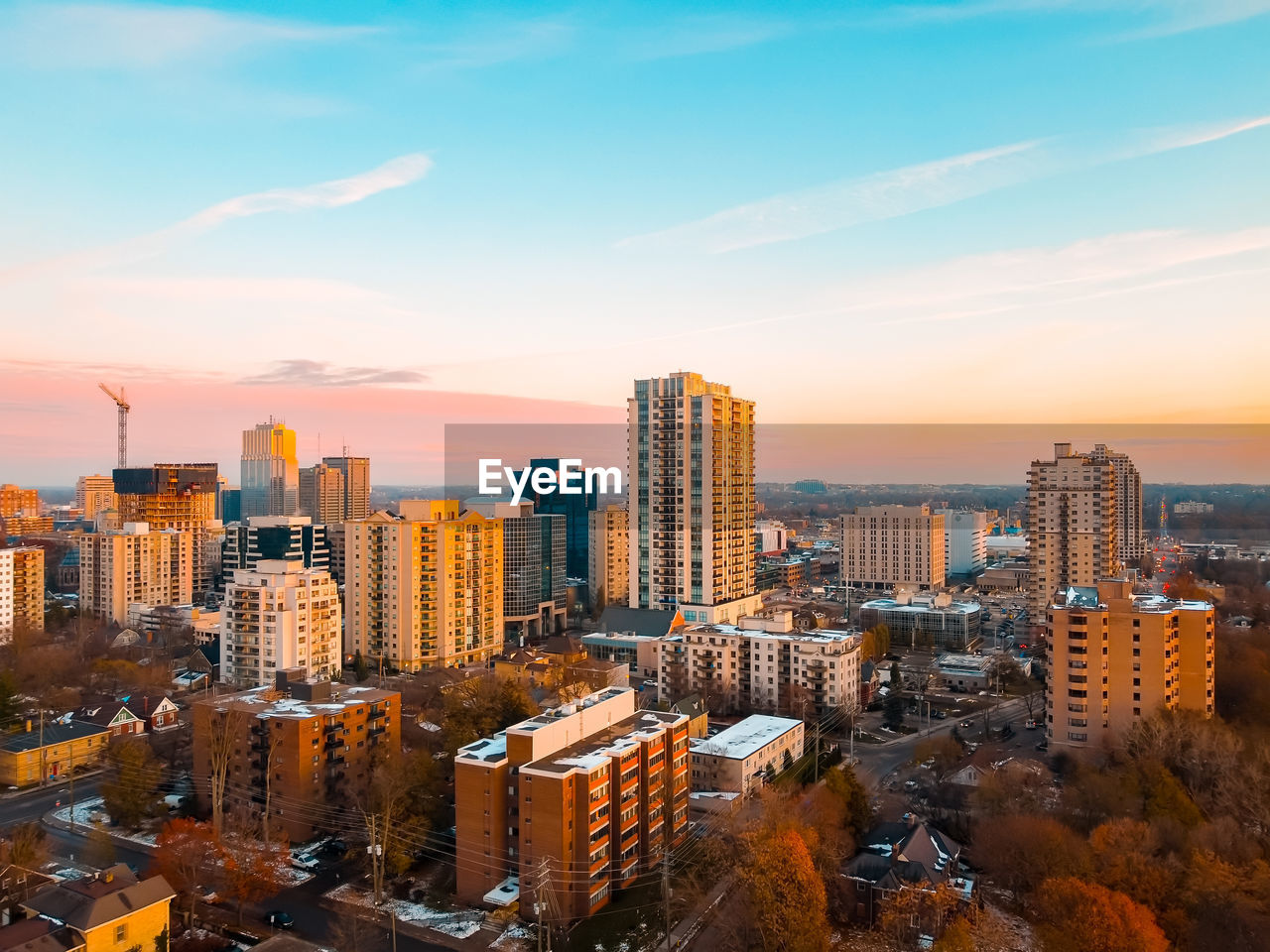 High angle view of buildings in city against sky during sunset