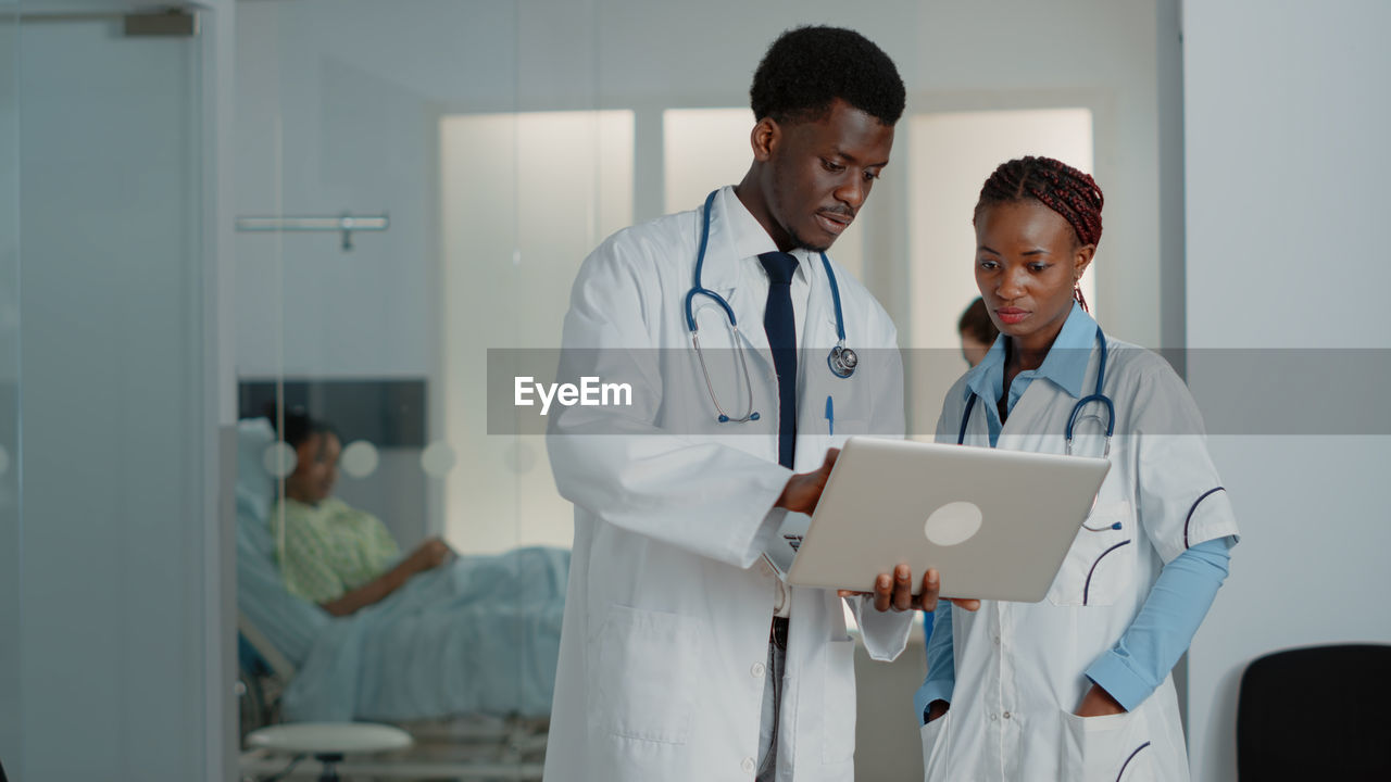 Doctor using digital tablet