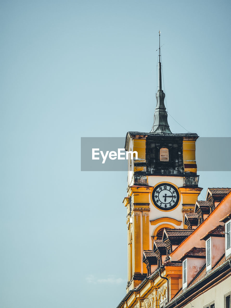 Low angle view of clock tower against clear sky