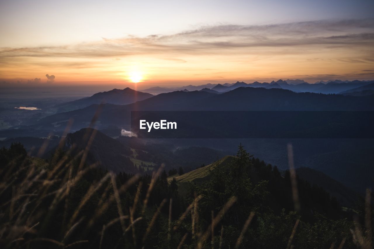 Scenic view of mountains against sky during sunset