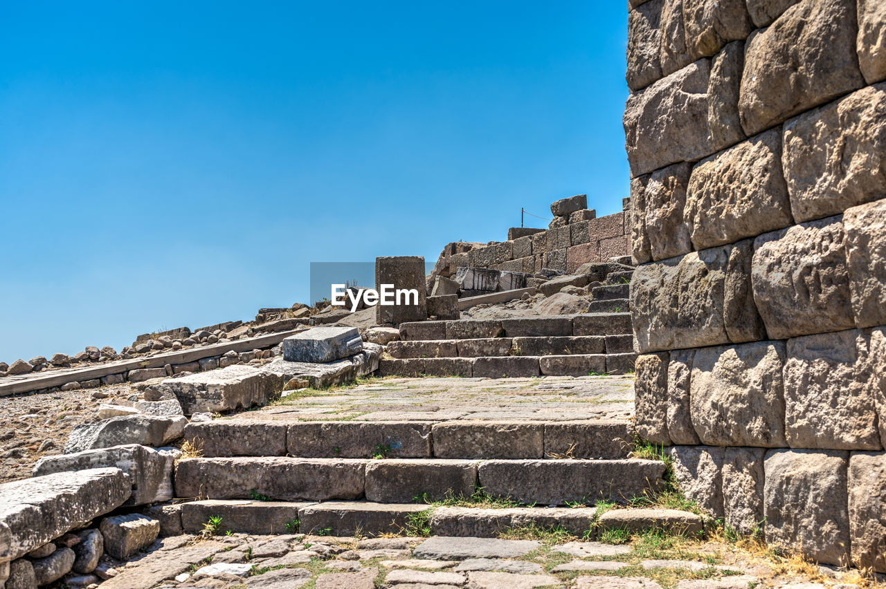 Low angle view of historical building against blue sky