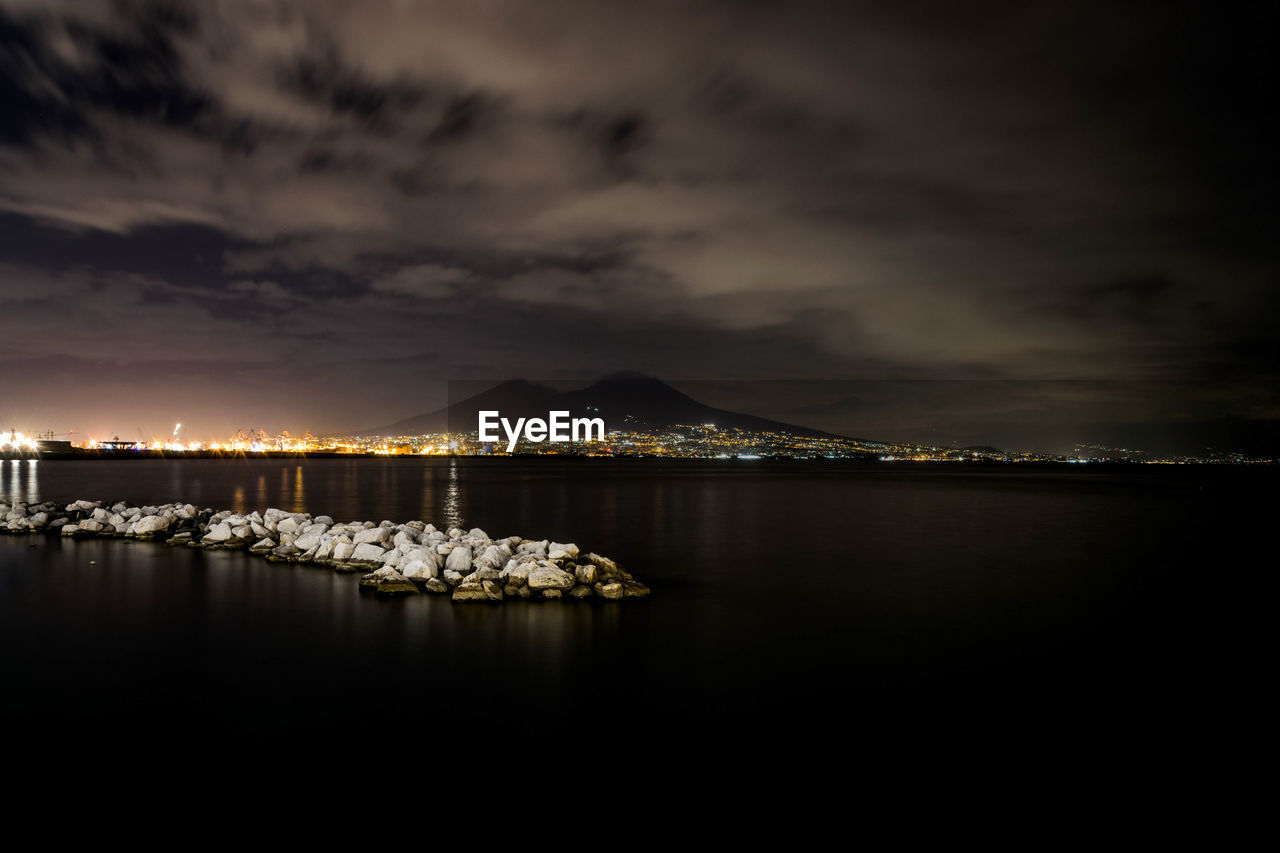 Scenic view of sea against sky at night