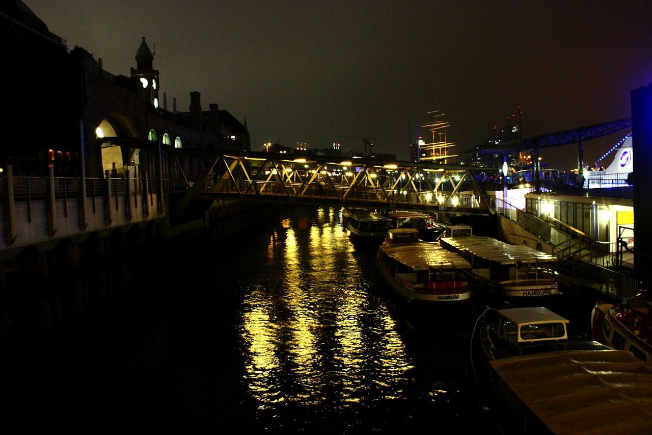 ILLUMINATED BRIDGE OVER RIVER