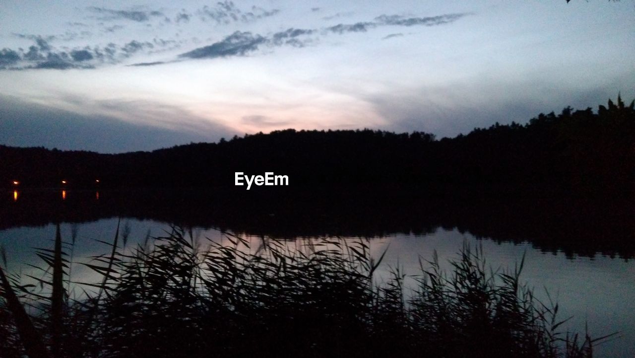 SILHOUETTE TREES BY LAKE AGAINST SKY DURING SUNSET