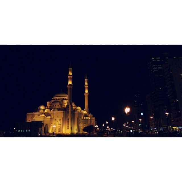 VIEW OF ILLUMINATED TOWER AT NIGHT