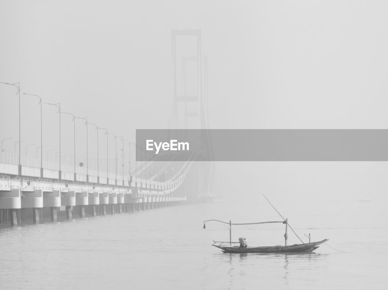 SAILBOAT ON BRIDGE AGAINST SKY