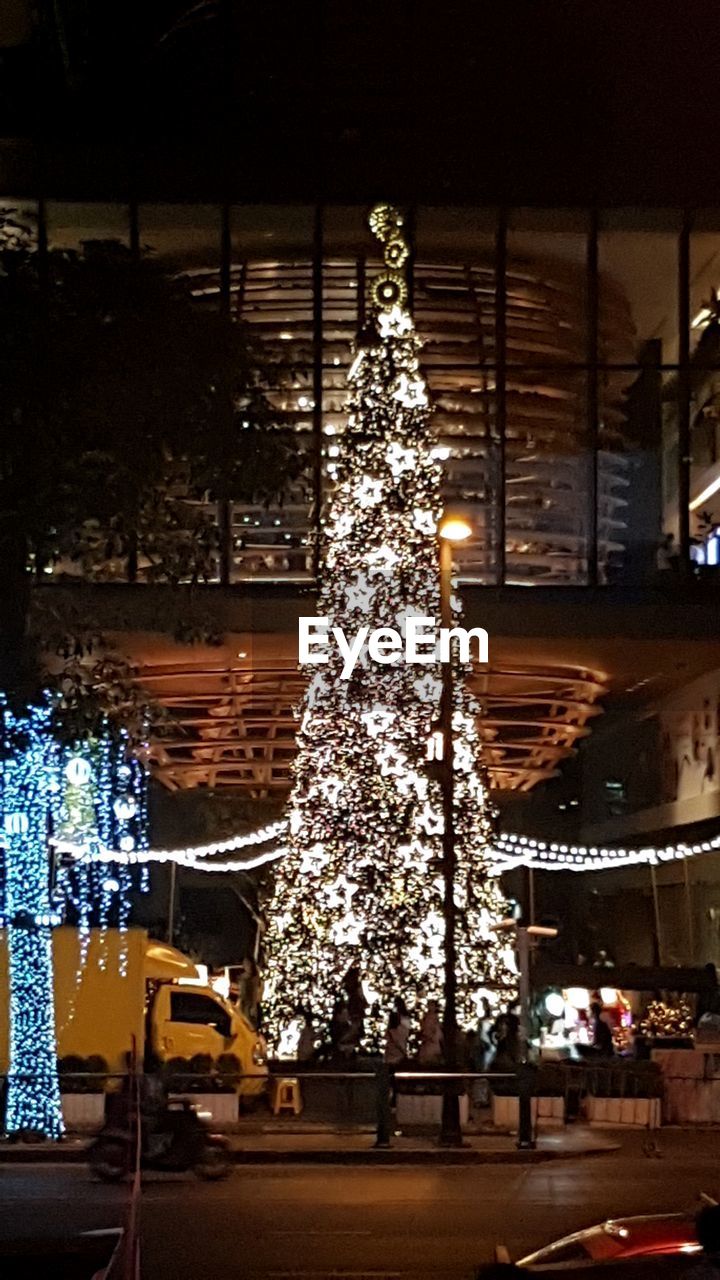 Illuminated christmas tree at night