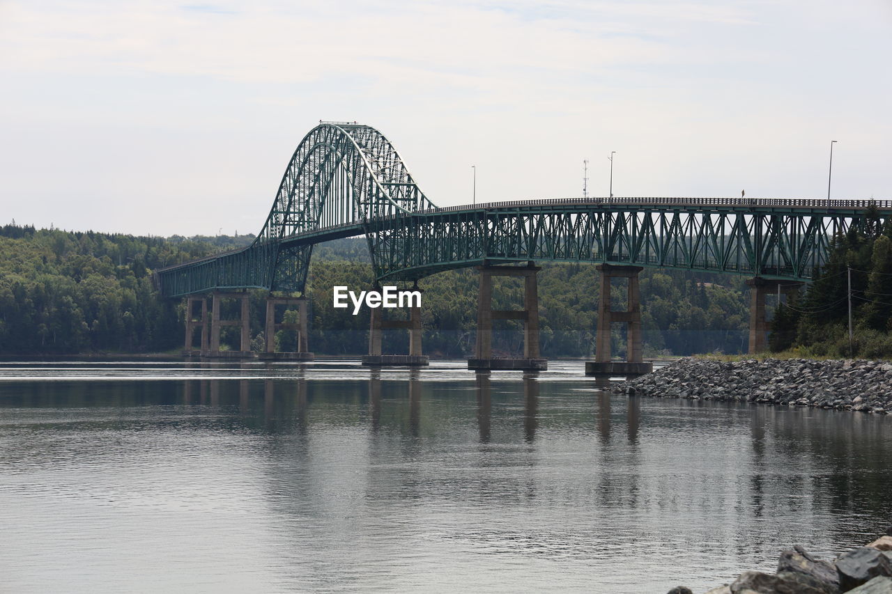 bridge, water, architecture, built structure, river, sky, reflection, nature, arch bridge, transportation, travel destinations, no people, cantilever bridge, landmark, travel, outdoors, city, day, tree, tourism, reservoir, waterway