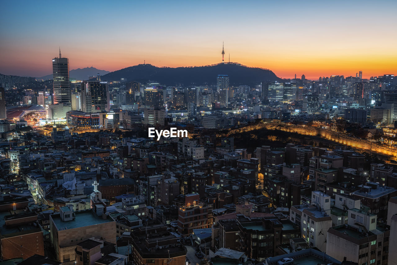 Sunset view over seoul city with view of n seoul tower. taken from changsindong, seoul, south korea
