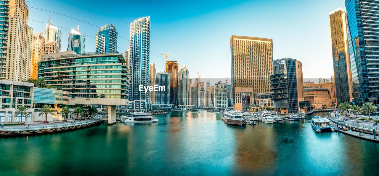 Panoramic view of modern buildings against sky
