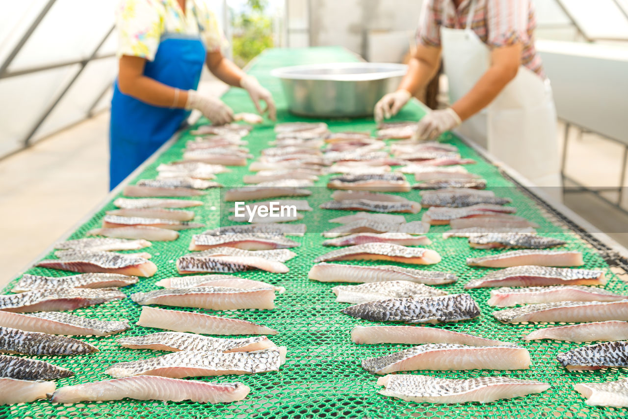 Food preservation by fish drying. dried tilapia. food processing of fishermen in thailand