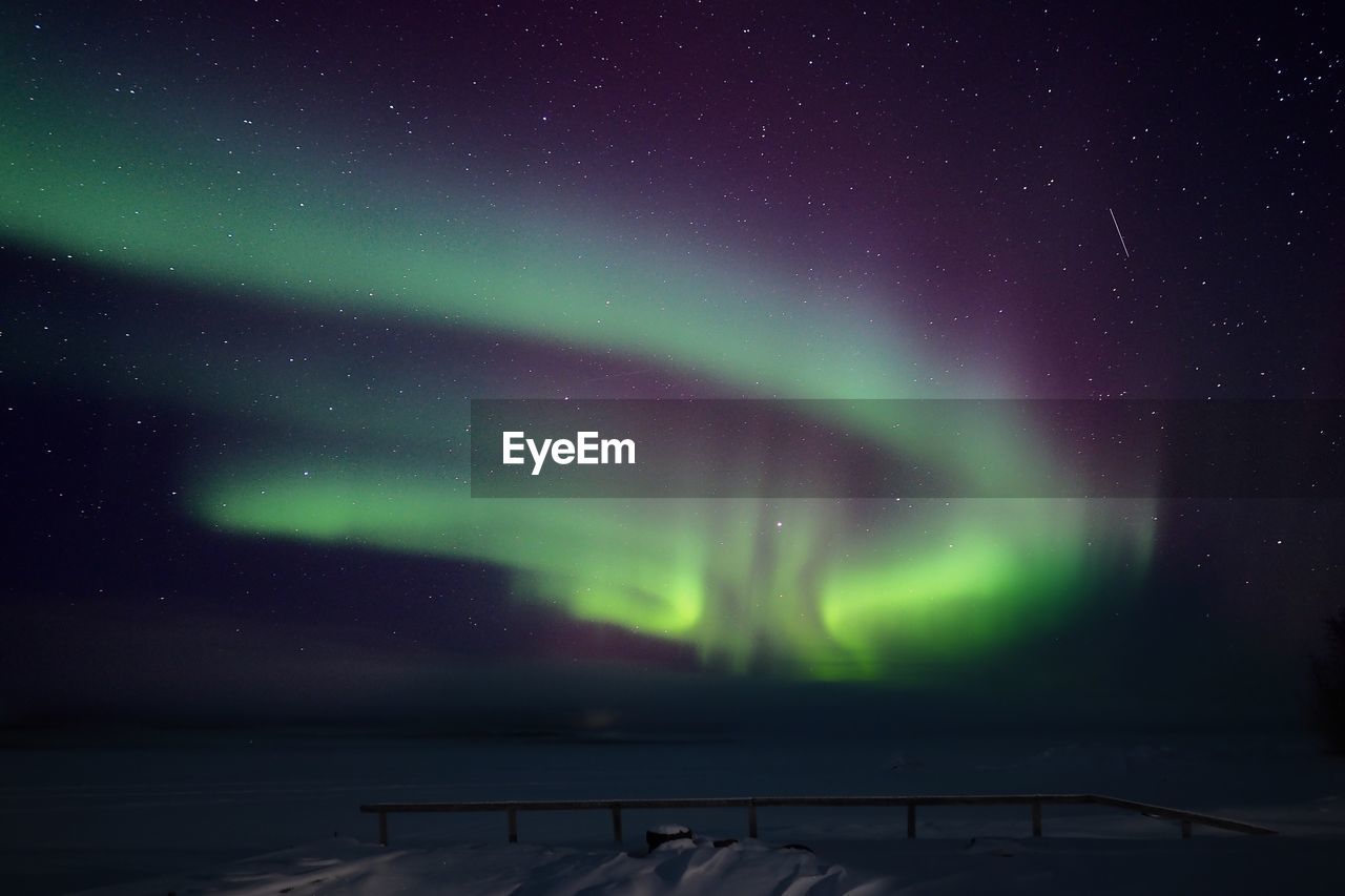 Scenic view of landscape against sky at night