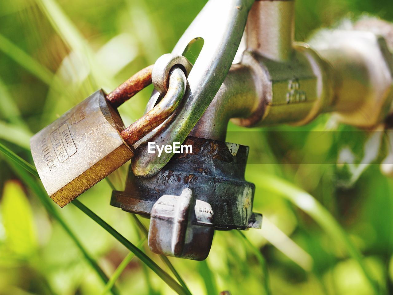 Close-up of locked water tap