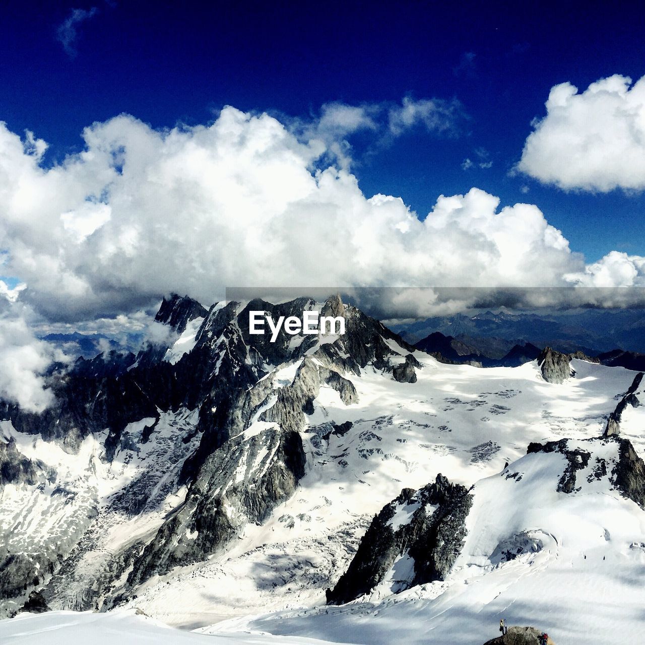 View of mountain range against cloudy sky