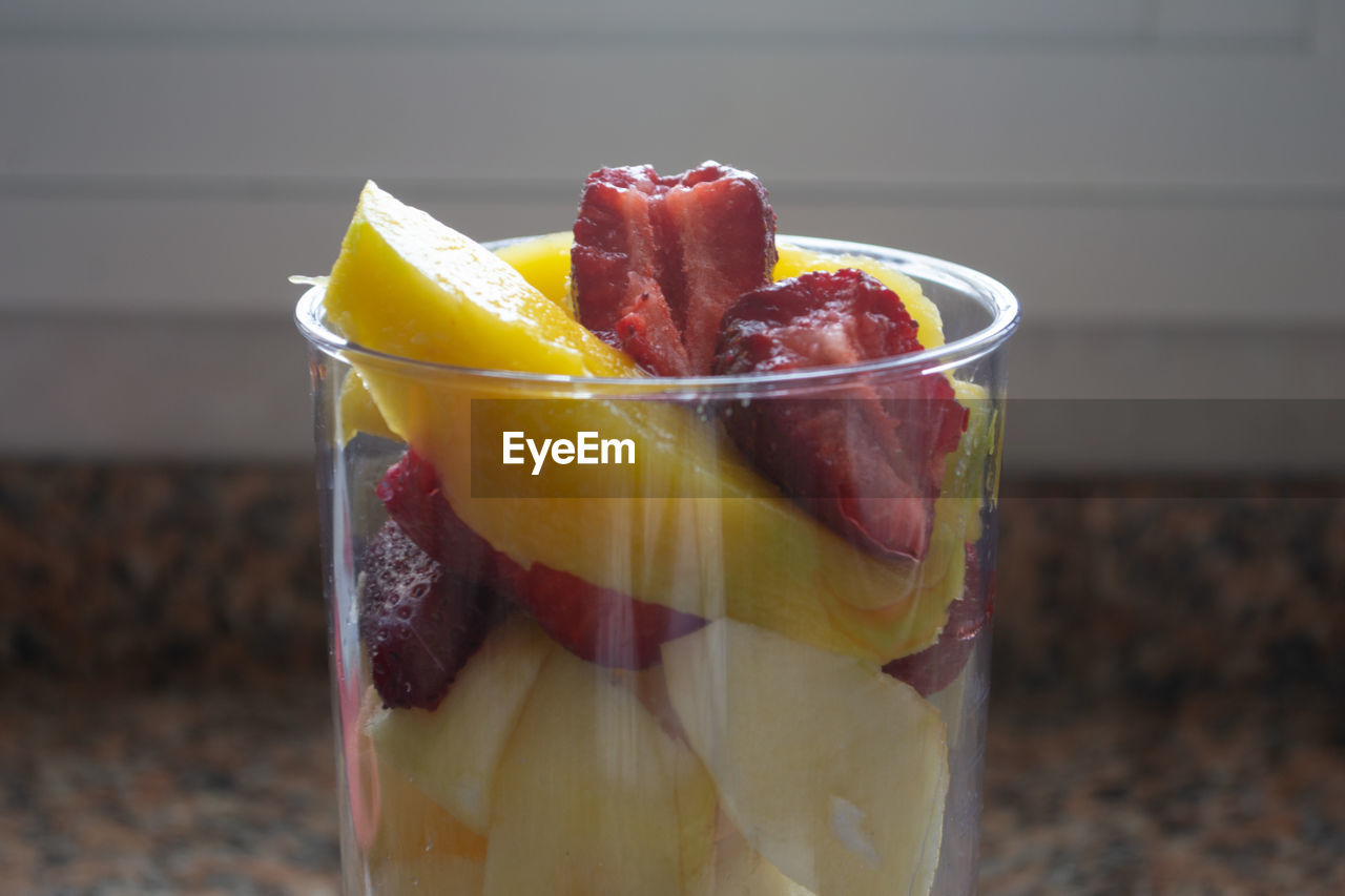 CLOSE-UP OF FRESH FRUITS IN GLASS