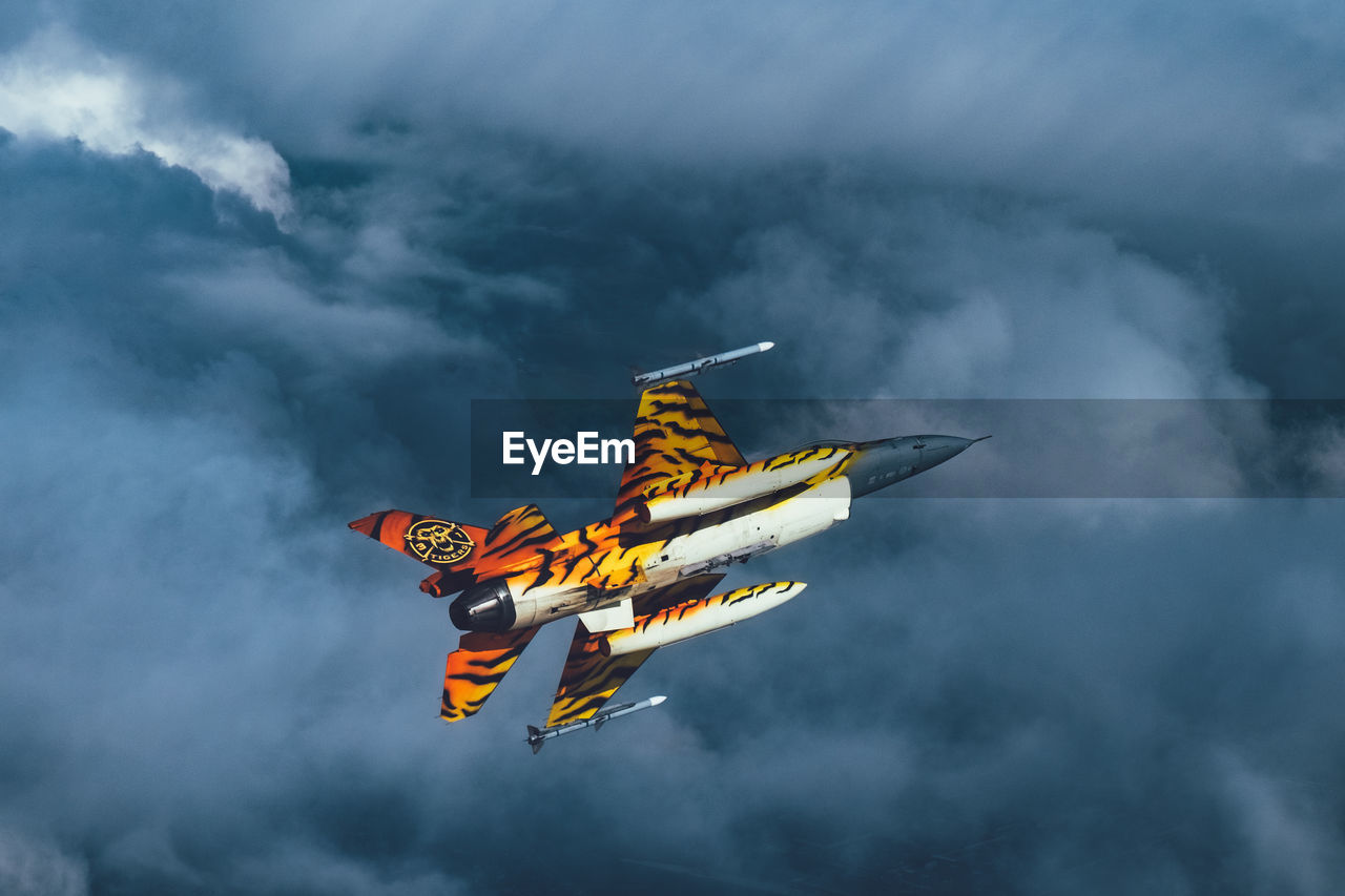 LOW ANGLE VIEW OF AIRPLANE AGAINST SKY