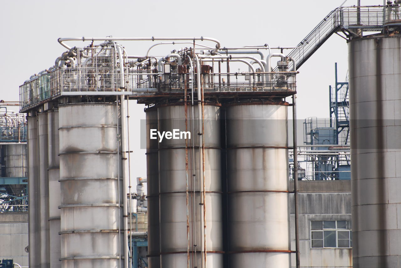 Low angle view of industrial building against sky