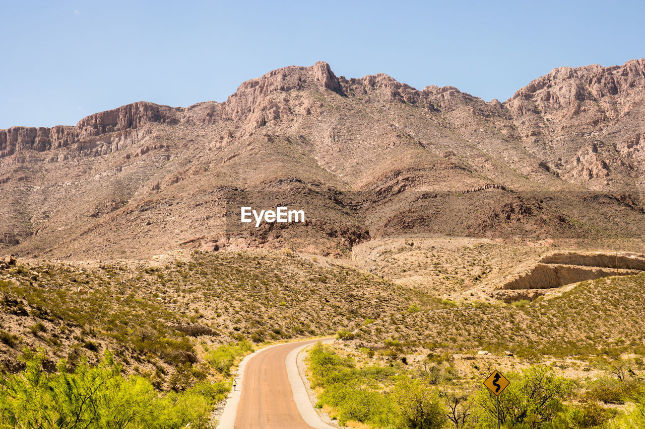 ROAD LEADING TOWARDS MOUNTAINS