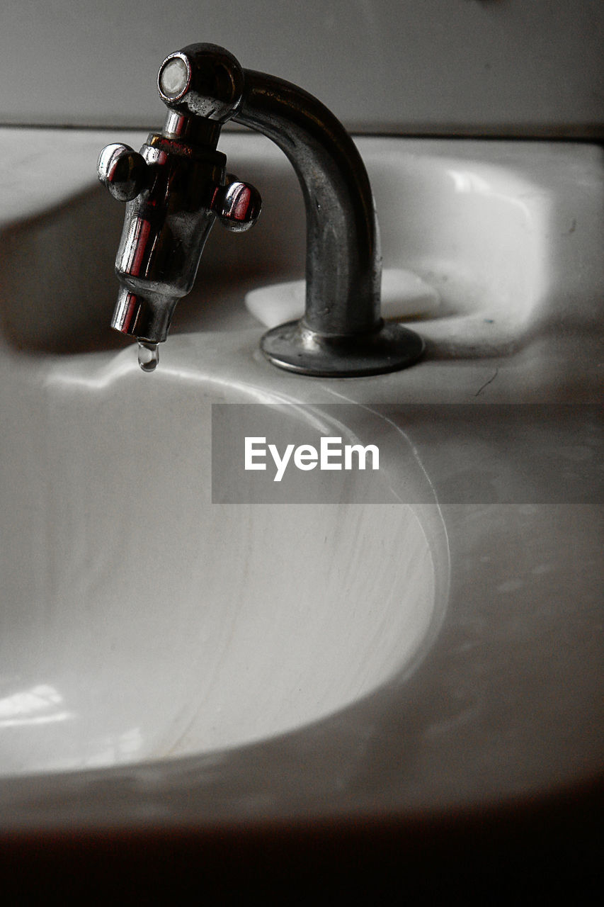 Close-up of faucet in bathroom