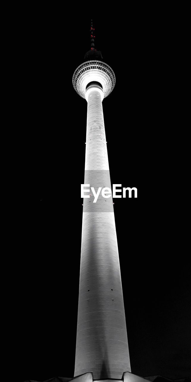 Low angle view of illuminated fernsehturm against sky