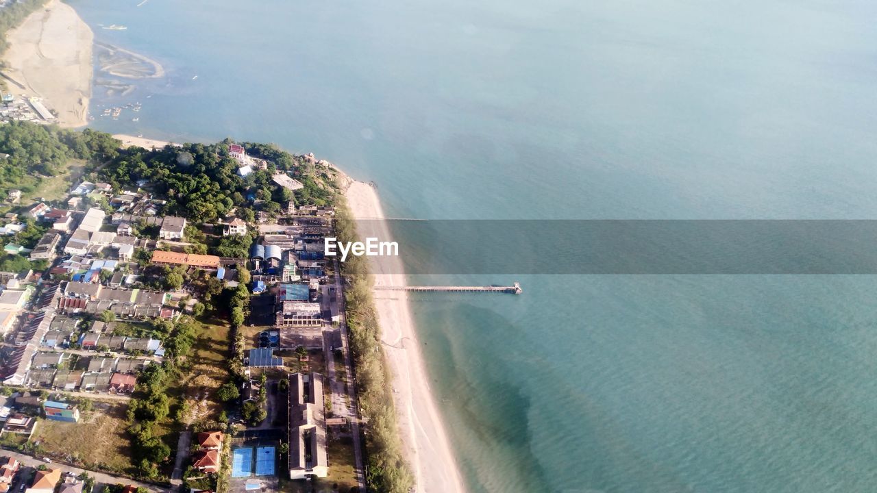 High angle view of buildings by sea