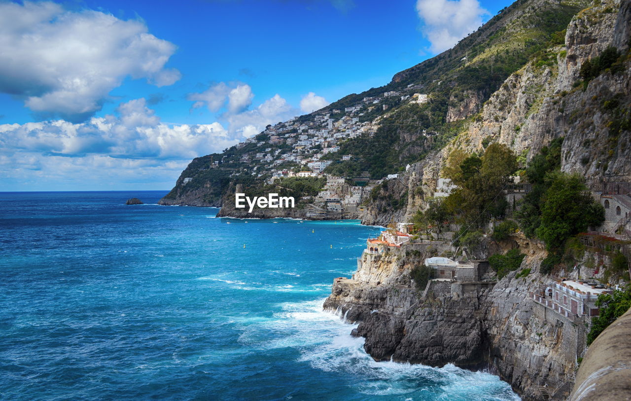 Scenic view of sea against blue sky