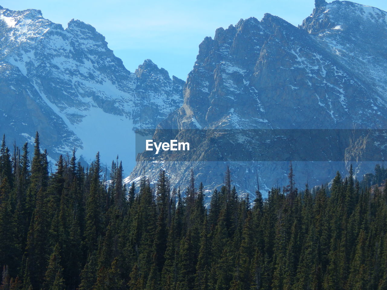 Scenic view of mountains against sky during winter